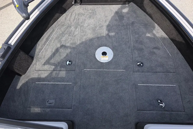 Slide: The Image of 2026 Smoker Craft Explorer 190 FS boat deck with storage compartments and carpeted surface. - 11