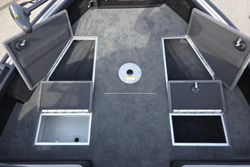 Slide: The Image of 2026 Smoker Craft Explorer 190 FS boat interior with open storage compartments. - 12