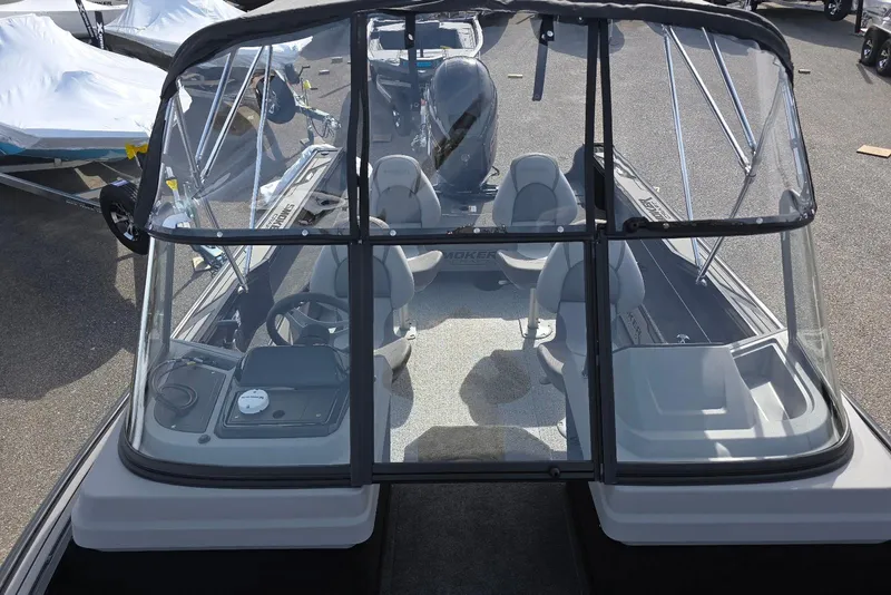 Slide: The Image of 2026 Smoker Craft Explorer 190 FS boat interior with seating and steering console. - 15
