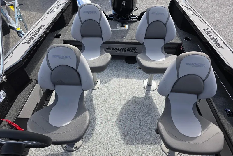 Slide: The Image of 2026 Smoker Craft Explorer 190 FS boat interior with four gray seats. - 16