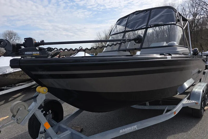 Slide: The Image of 2026 Smoker Craft Explorer 190 FS boat on trailer, featuring Minn Kota Terrova motor. - 2
