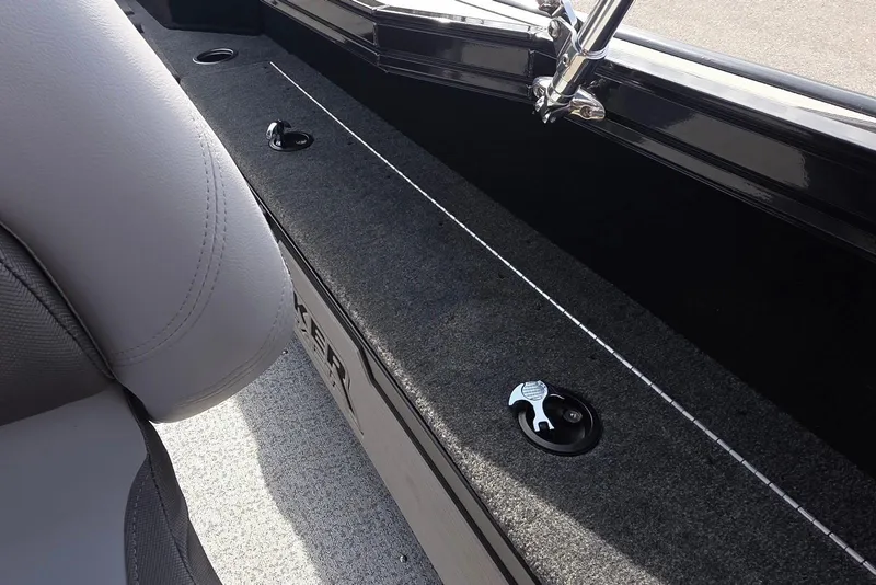 Slide: The Image of 2026 Smoker Craft Explorer 190 FS interior detail with gray upholstery and storage compartments. - 22