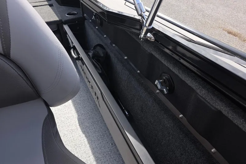 Slide: The Image of Interior view of 2026 Smoker Craft Explorer 190 FS boat, featuring seating and storage compartments. - 23