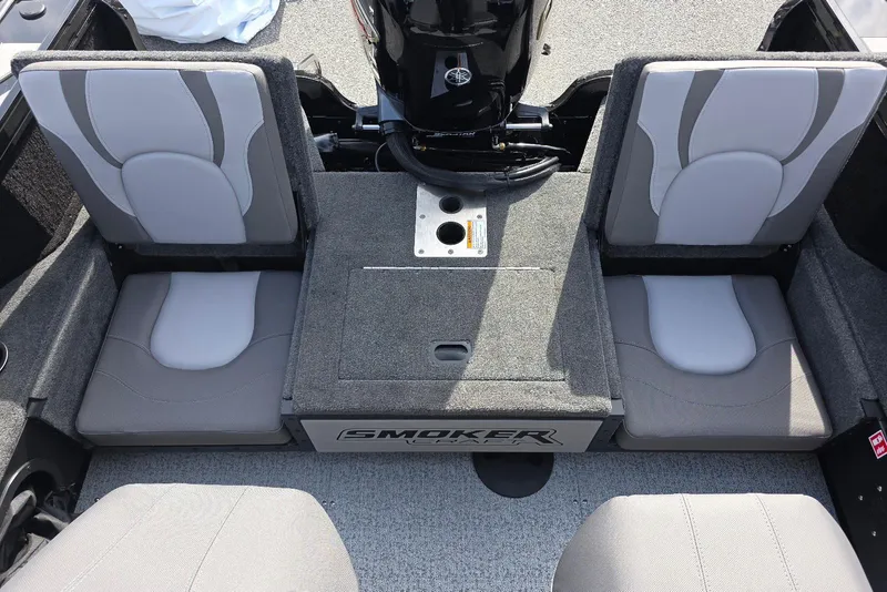Slide: The Image of 2026 Smoker Craft Explorer 190 FS boat interior with gray seating and motor. - 25