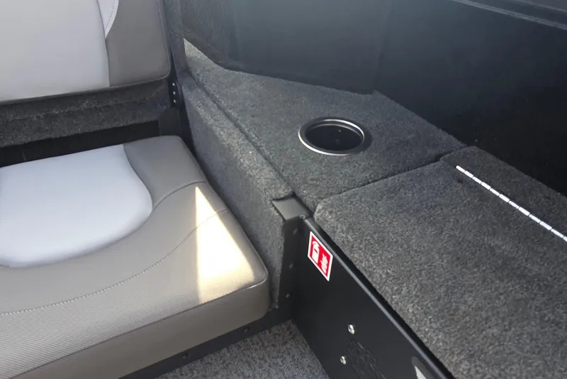 Slide: The Image of Interior of 2026 Smoker Craft Explorer 190 FS with seating and cup holder. - 27