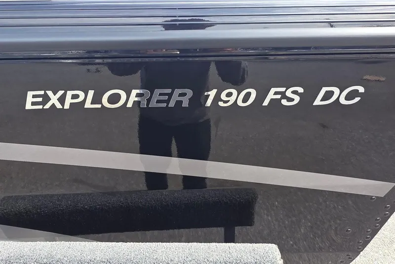 Slide: The Image of 2026 Smoker Craft Explorer 190 FS DC boat exterior with model name displayed. - 3