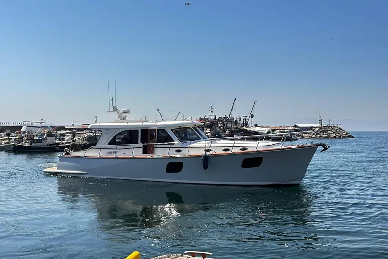 The Image of 2026 Vicem 55 Classic yacht docked in a serene harbor setting. - 0
