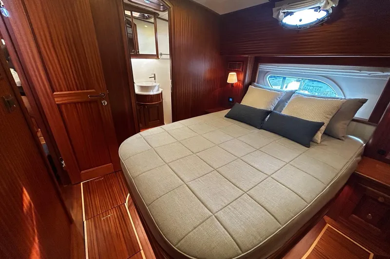 Slide: The Image of Luxurious cabin interior of 2026 Vicem 55 Classic yacht with elegant wood finishes. - 13