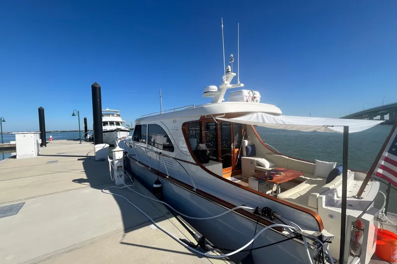 Slide: The Image of 2026 Vicem 55 Classic yacht docked at marina under clear blue sky. - 19