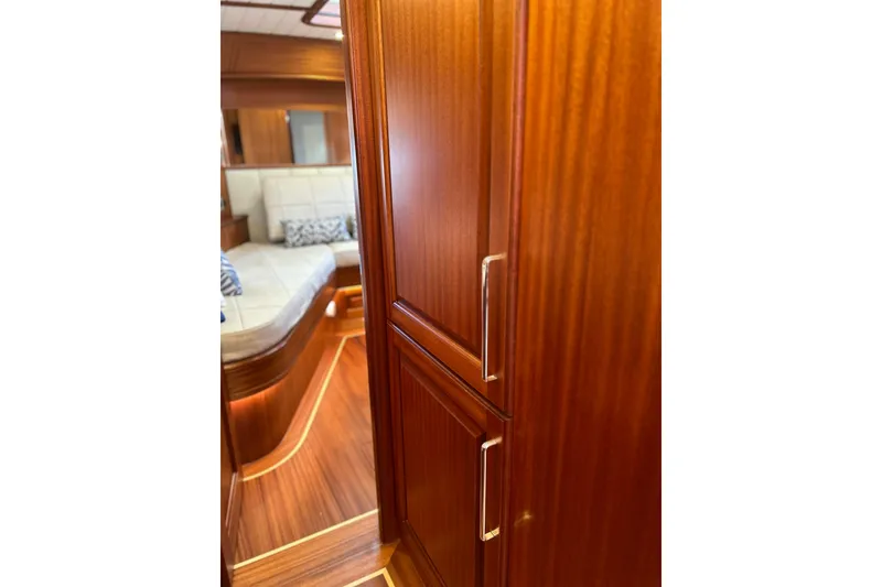 Slide: The Image of Luxurious wooden interior of 2026 Vicem 55 Classic yacht, featuring elegant cabinetry and seating. - 8
