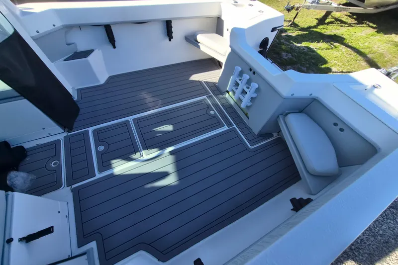 Slide: The Image of Interior of 2026 Arima 21 HT Sea Ranger boat with rod holders and seating. - 5
