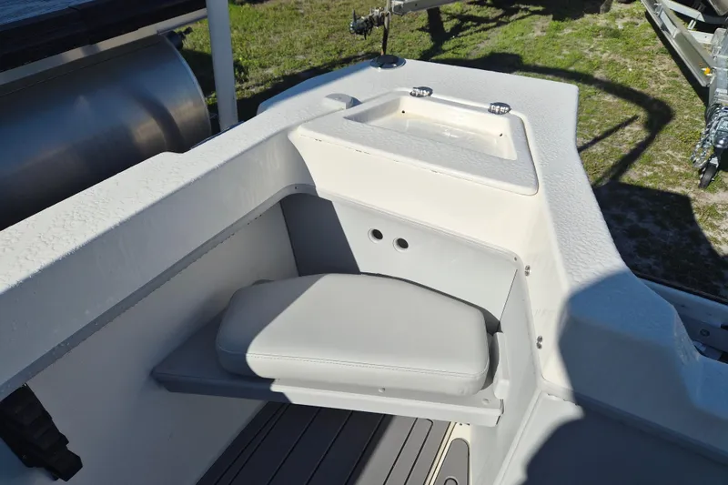 Slide: The Image of Open storage compartment on 2026 Arima 21 HT Sea Ranger boat deck. - 6