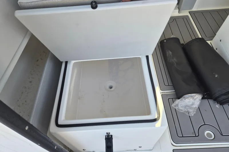 Slide: The Image of Interior of 2026 Arima 21 HT Sea Ranger boat with steering wheel and seating. - 9