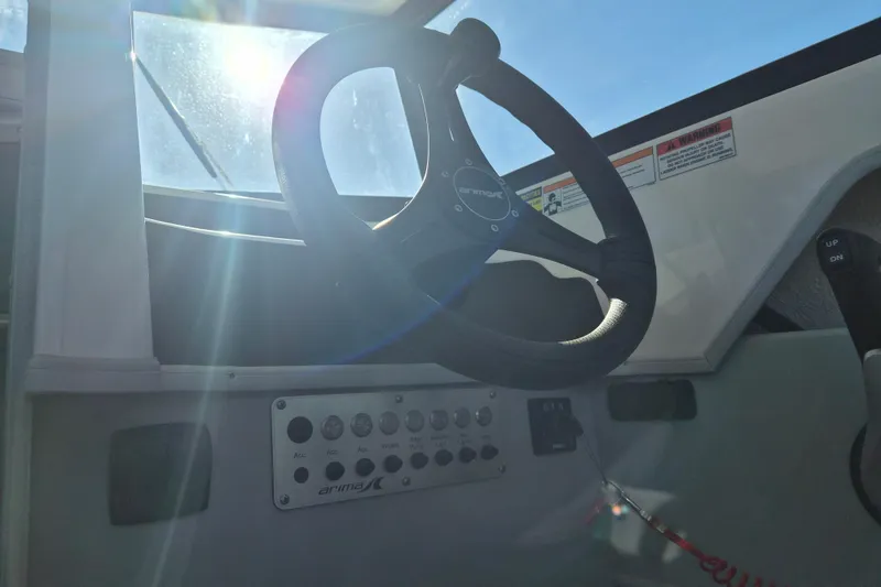 Slide: The Image of Captain's chair in 2026 Arima 21 HT Sea Ranger boat interior. - 12