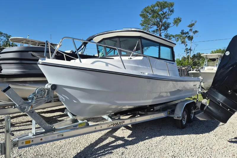 Slide: The Image of 2026 Arima 21 HT Sea Ranger boat, rear view in a sunny outdoor setting. - 2