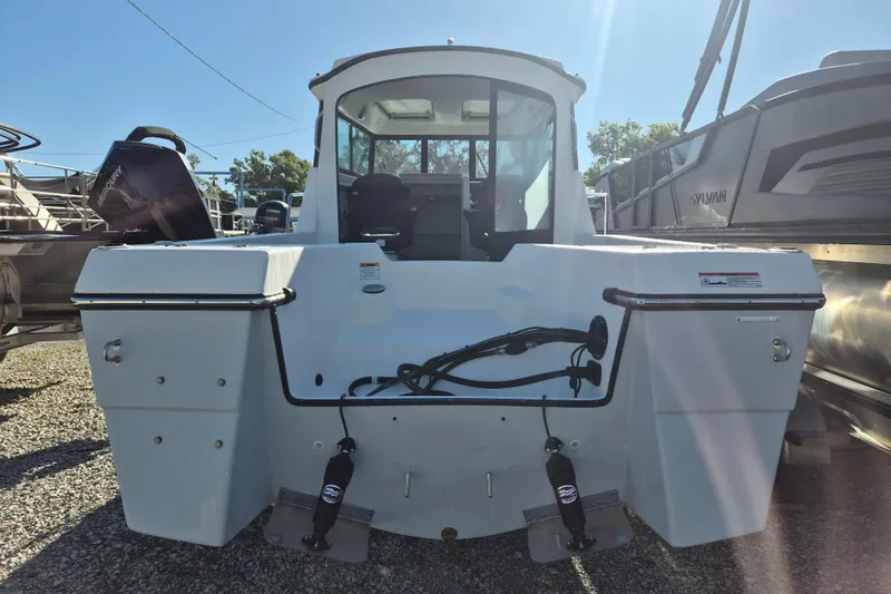 Slide: The Image of 2026 Arima 21 HT Sea Ranger boat interior with seating and storage compartment. - 4