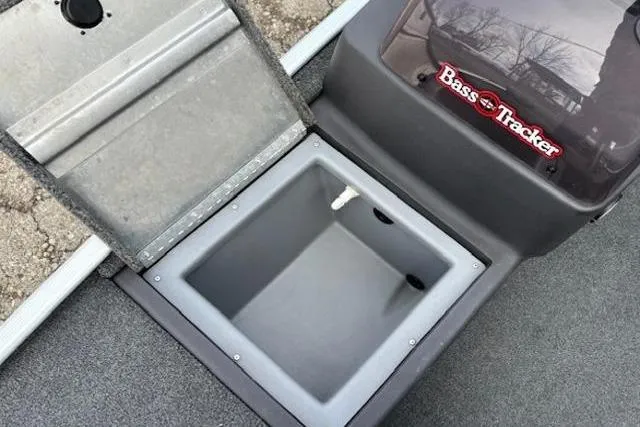 Slide: The Image of 2019 Tracker Bass Tracker Classic XL boat storage compartment open, showcasing interior space. - 12