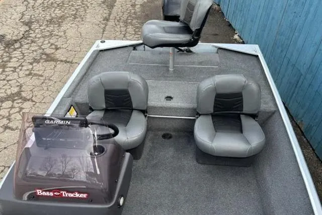 Slide: The Image of 2019 Tracker Bass Tracker Classic XL boat interior with seating and Garmin equipment. - 13