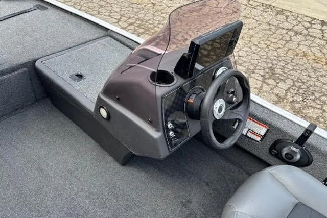 Slide: The Image of 2019 Tracker Bass Tracker Classic XL boat console with steering wheel and windshield. - 15