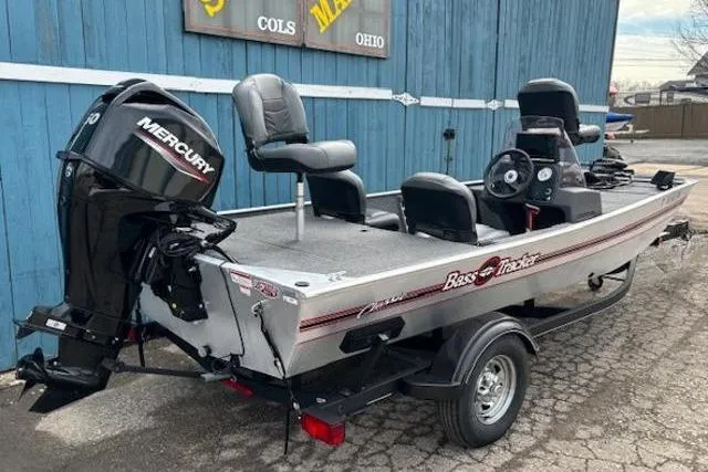 Slide: The Image of 2019 Tracker Bass Tracker Classic XL boat with Mercury engine, parked on a trailer. - 2