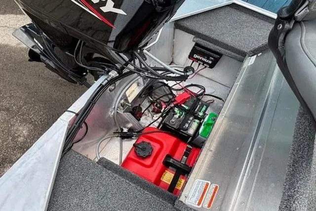 Slide: The Image of 2019 Tracker Bass Tracker Classic XL boat engine compartment with battery and fuel tank. - 20