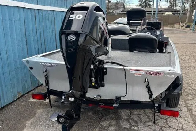 Slide: The Image of 2019 Tracker Bass Tracker Classic XL boat with 50 HP motor, parked outdoors. - 3