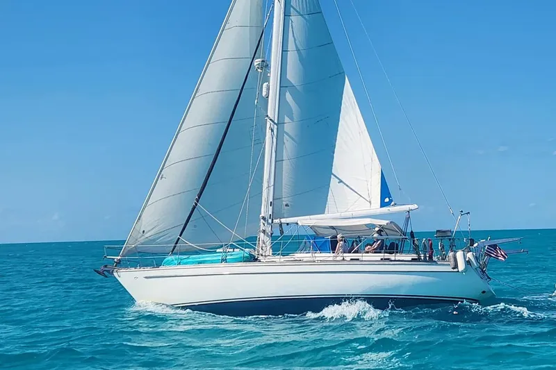 The Image of 1981 Gulfstar 44 sailboat cruising on clear blue ocean waters. - 0