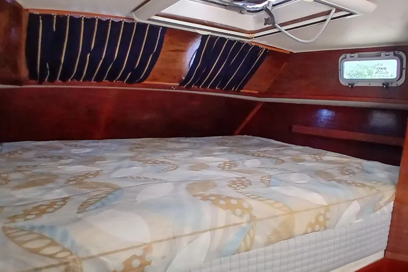 Slide: The Image of Interior cabin of 1981 Gulfstar 44 yacht with cozy bed and wooden finish. - 22