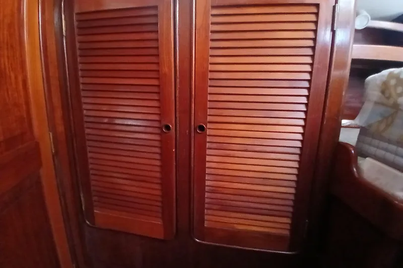 Slide: The Image of Wooden louvered doors inside a 1981 Gulfstar 44 yacht cabin. - 28