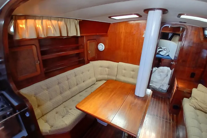 Slide: The Image of Interior of 1981 Gulfstar 44 yacht with wooden furnishings and cushioned seating. - 3
