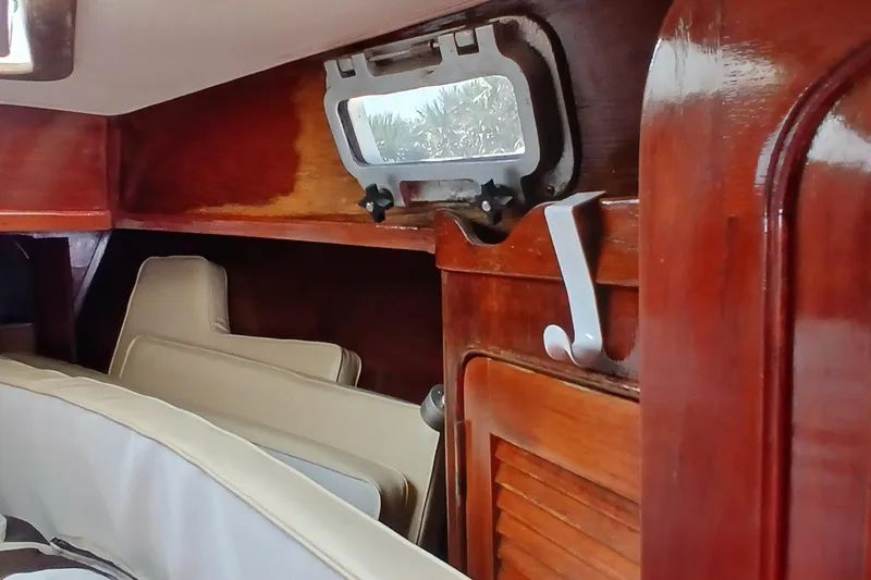 Slide: The Image of Interior of 1981 Gulfstar 44 sailboat with wooden finish and porthole. - 39