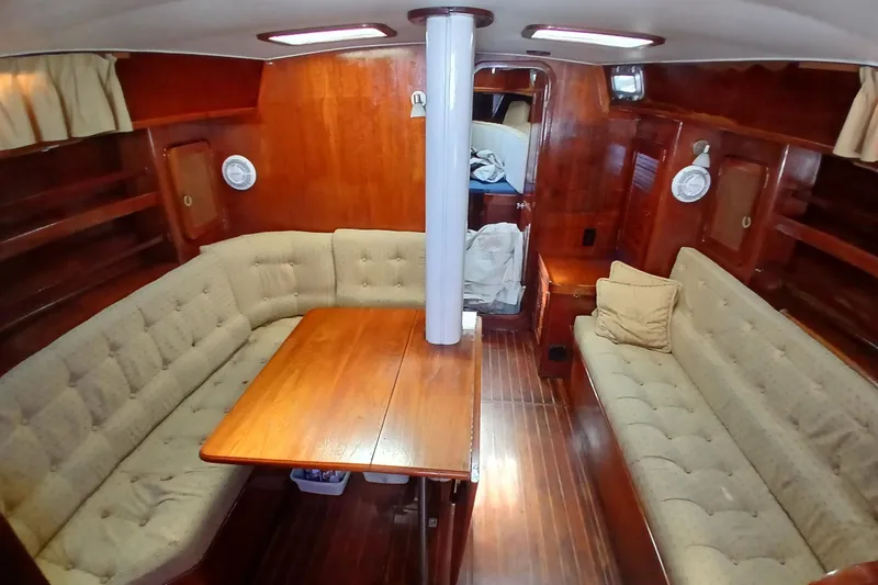 Slide: The Image of Interior of 1981 Gulfstar 44 yacht with wooden furnishings and cushioned seating. - 4