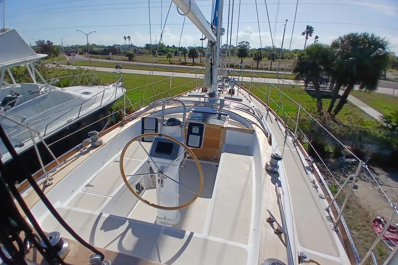 Slide: The Image of 1981 Gulfstar 44 sailboat deck with steering wheel and navigation equipment. - 47