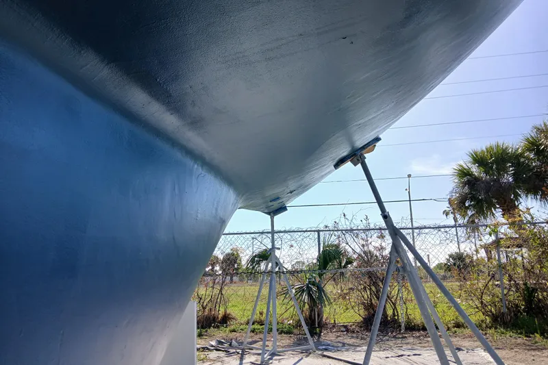 Slide: The Image of Bottom view of a 1981 Gulfstar 44 sailboat hull on stands, outdoors. - 61