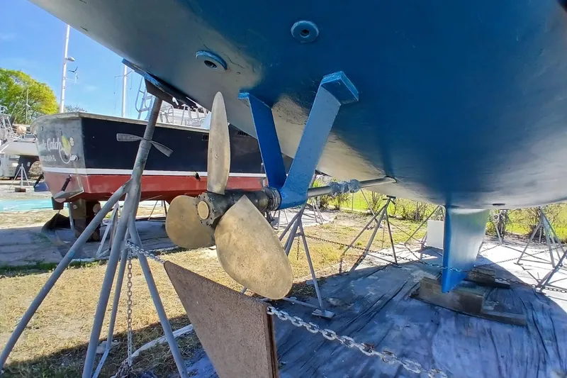 Slide: The Image of 1981 Gulfstar 44 sailboat on stands, showing propeller and hull details. - 62