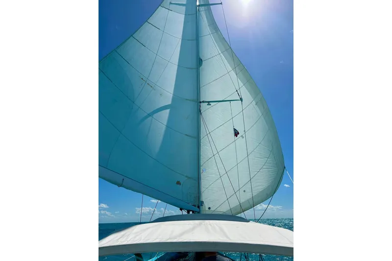 Slide: The Image of Sailing on a 1981 Gulfstar 44 yacht under clear blue skies. - 72