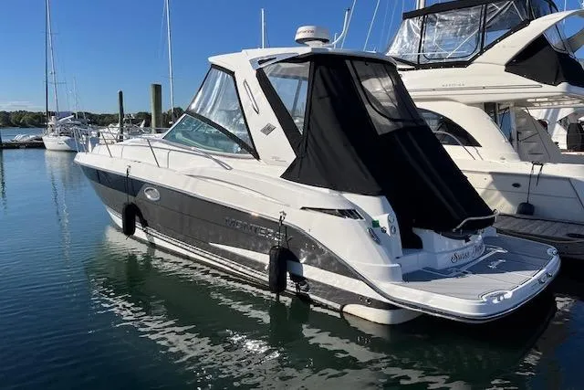 The Image of 2019 Monterey 355 Sport Yacht docked in a marina, featuring sleek design and modern amenities. - 0