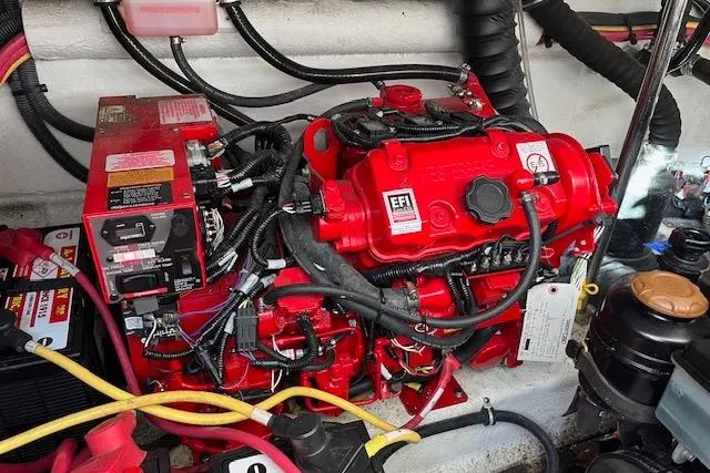 Slide: The Image of Engine compartment of a 2019 Monterey 355 Sport Yacht with red EFI engine components. - 16