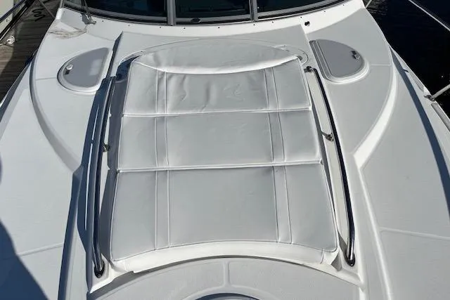 Slide: The Image of 2019 Monterey 355 Sport Yacht deck with white sunpad and sleek design. - 3