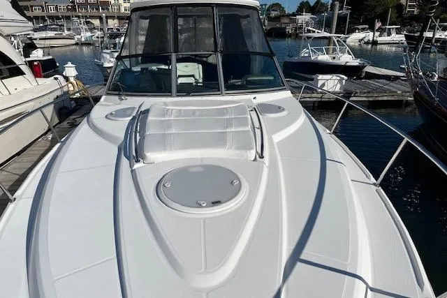 Slide: The Image of 2019 Monterey 355 Sport Yacht docked at marina, showcasing sleek design and spacious deck. - 4