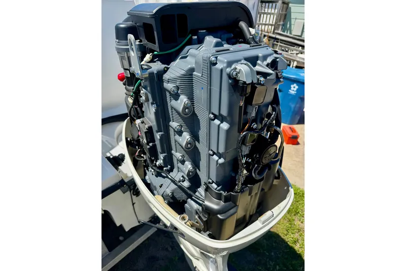 Slide: The Image of Outboard motor of a 2000 Glacier Bay 2670 Isle Runner, detailed view. - 12