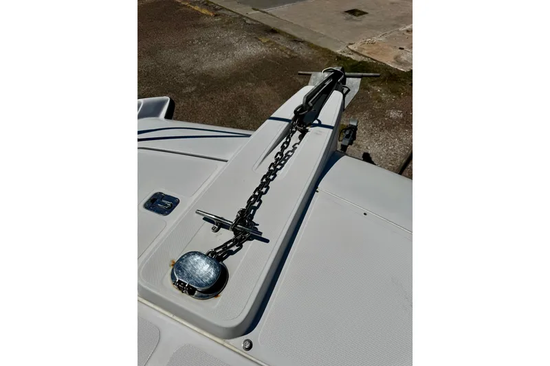 Slide: The Image of Bow of 2000 Glacier Bay 2670 Isle Runner with anchor chain and cleat. - 14