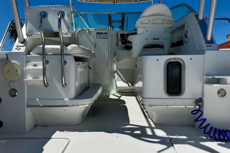 Slide: The Image of Interior view of 2000 Glacier Bay 2670 Isle Runner boat cockpit with seating and controls. - 27