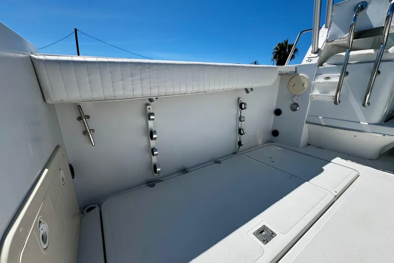 Slide: The Image of Interior view of a 2000 Glacier Bay 2670 Isle Runner boat, showcasing seating and storage. - 30