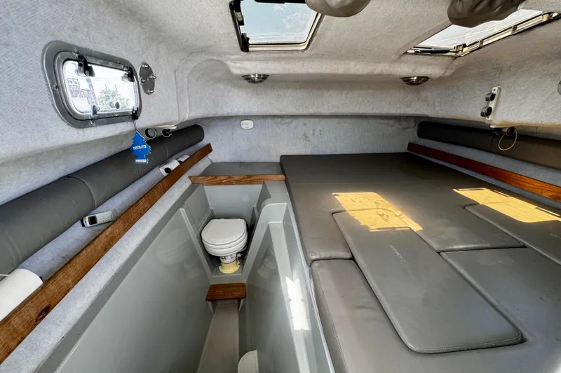 Slide: The Image of Interior of 2000 Glacier Bay 2670 Isle Runner boat with compact cabin and toilet. - 34