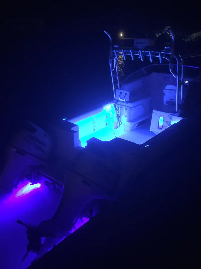 Slide: The Image of Glacier Bay 2670 Isle Runner 2000 with blue LED lights at night. - 40