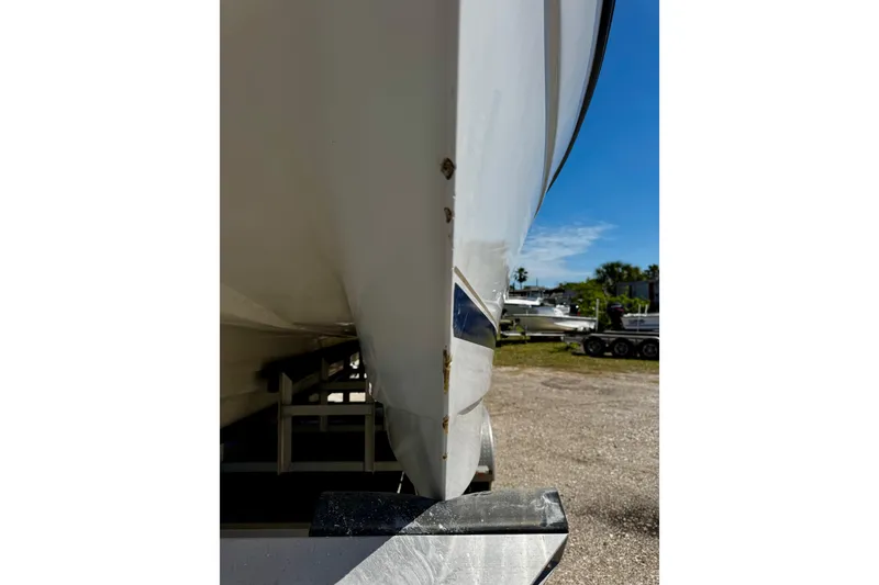Slide: The Image of Side view of a 2000 Glacier Bay 2670 Isle Runner boat on a trailer. - 43