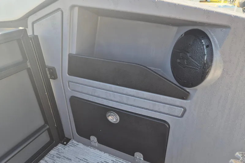 Slide: The Image of Interior of 2026 Sylvan R-22 CLZ DH boat with speaker and storage compartment. - 12