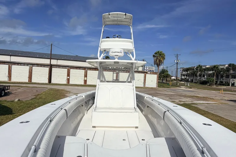 Slide: The Image of 2008 SeaHunter 40 Tournament boat with Garmin equipment, docked under a clear blue sky. - 17