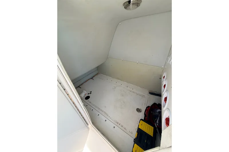 Slide: The Image of Interior cabin of a 2008 SeaHunter 40 Tournament boat, featuring storage compartments. - 19